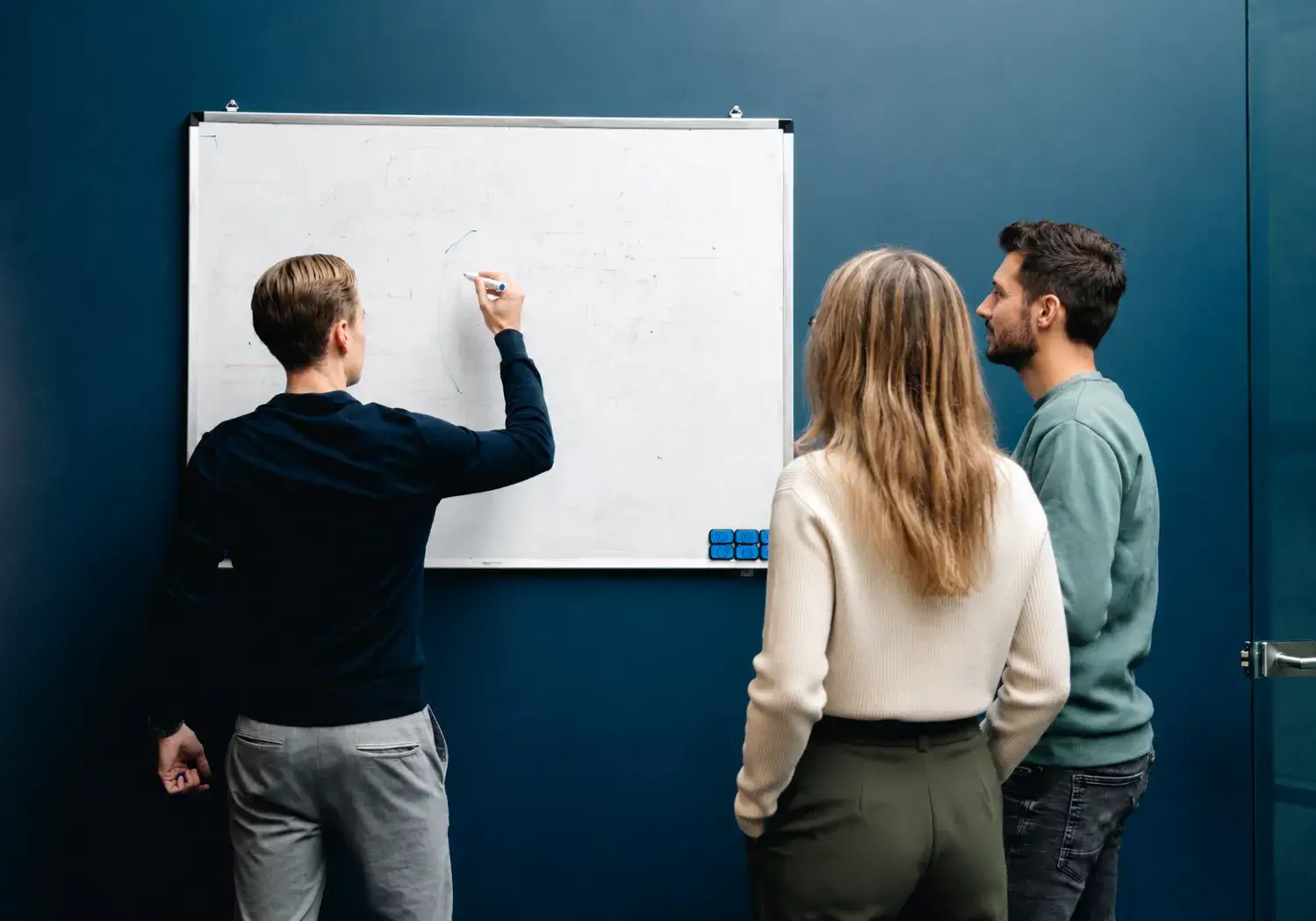 DevDiverse founders in a board room strategy session